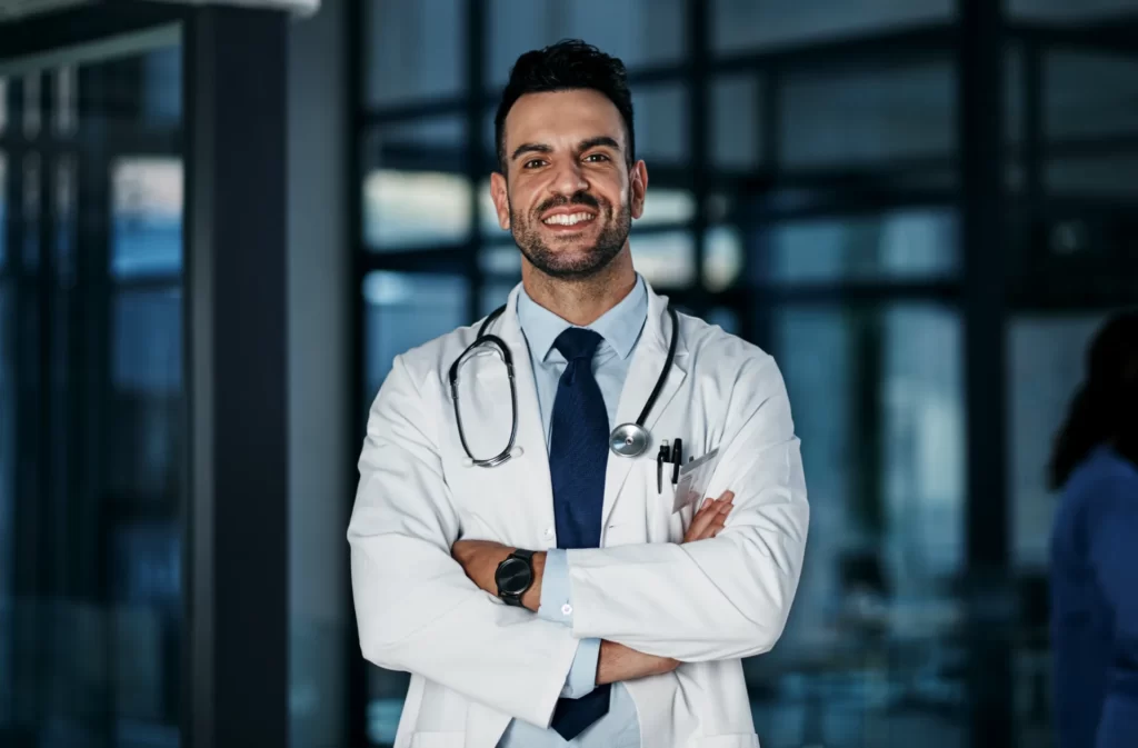 portrait doctor and happy man with arms crossed i utc